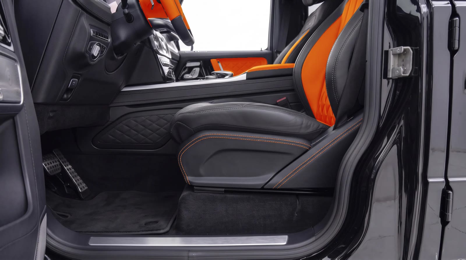 G-Wagon seat side panel visualization: black leather with orange stitching next to the orange seat centers