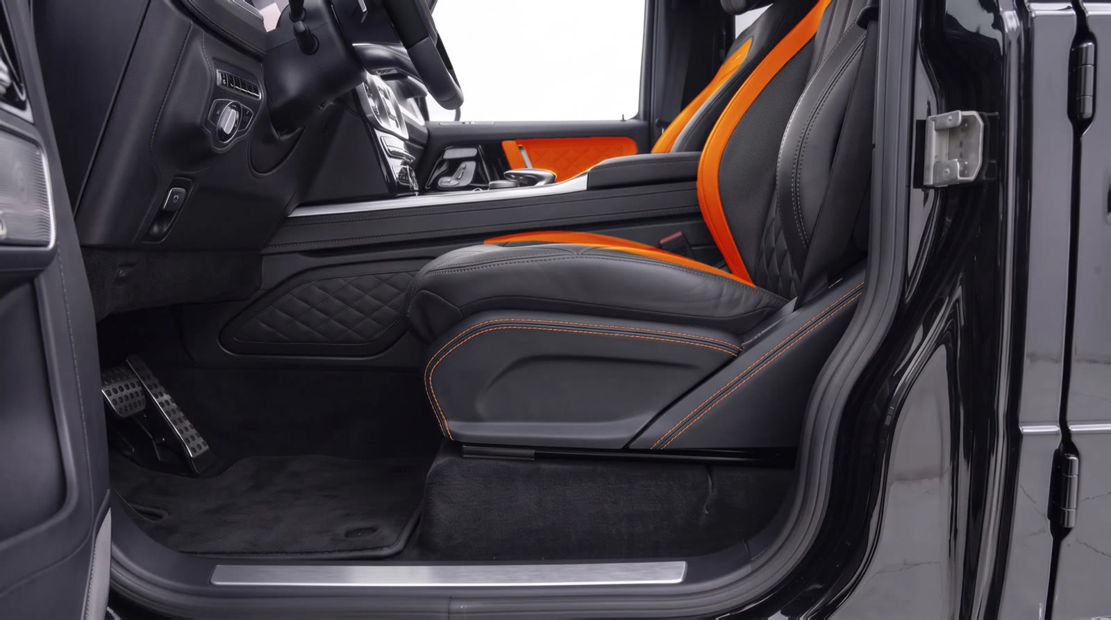 G-Wagon seat side panel visualization: black leather with orange stitching next to the orange seat band