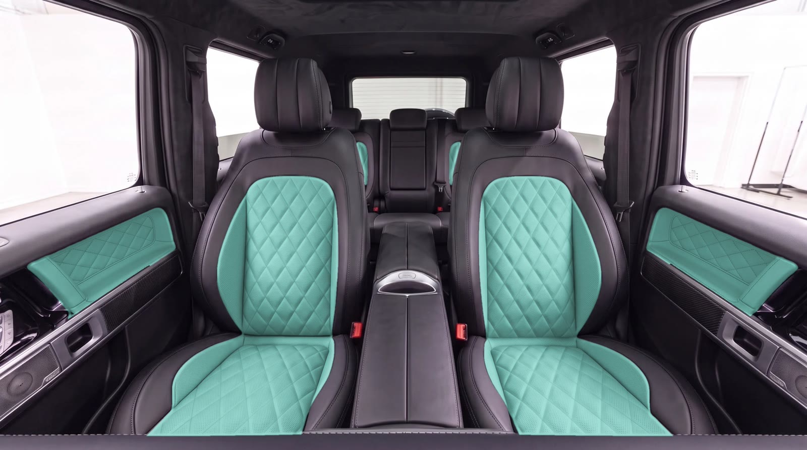 G-Wagon interior visualization: aqua seat centers and door inserts with the factory black seat band, classic diamond quilting