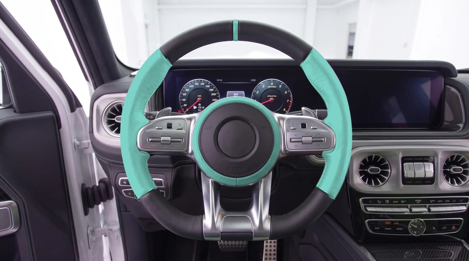 G-Wagon steering wheel visualization: aqua grips and zero mark, black top and bottom, airbag cover with a aqua ring
