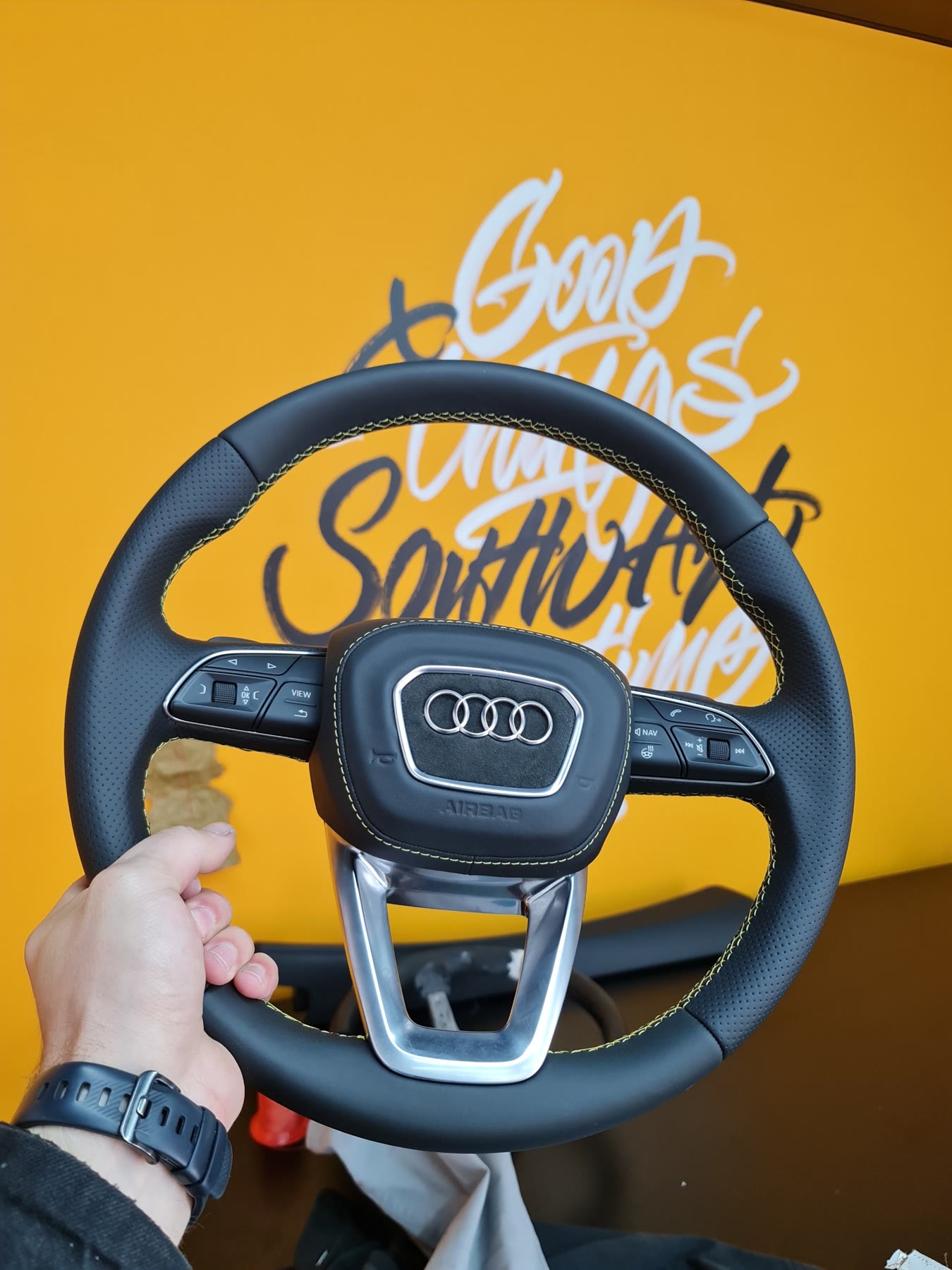 An Audi steering wheel re-trimmed in black leather