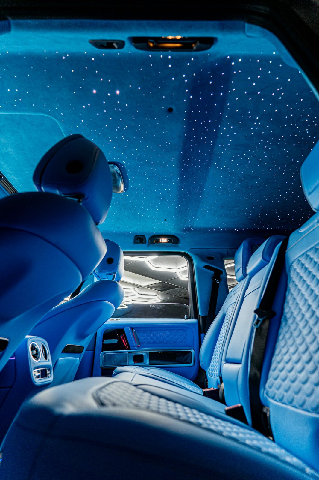 A G-Wagon with sky-blue quilted seats under a starlight headliner