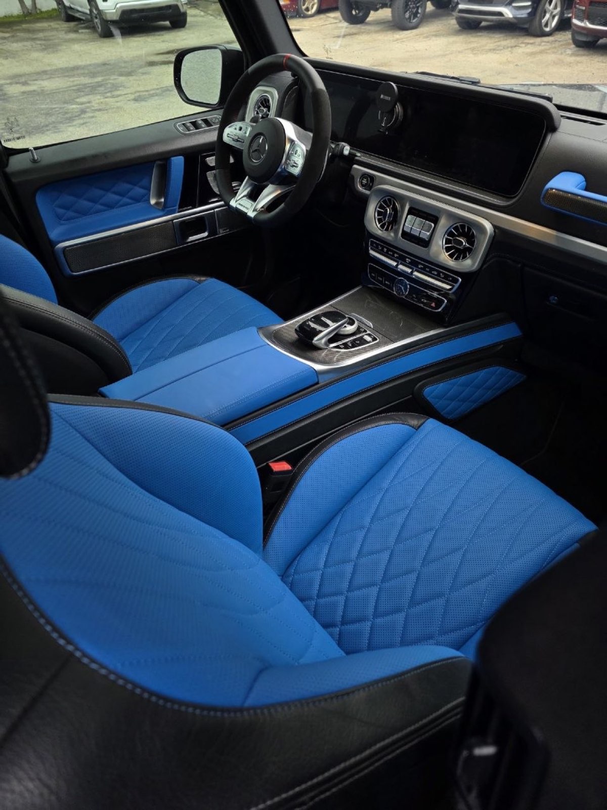 A G-Wagon with the seats, door panels and armrest in blue leather