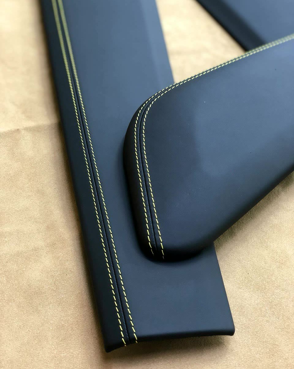 A contrast double stitch around the corner of an armrest.
