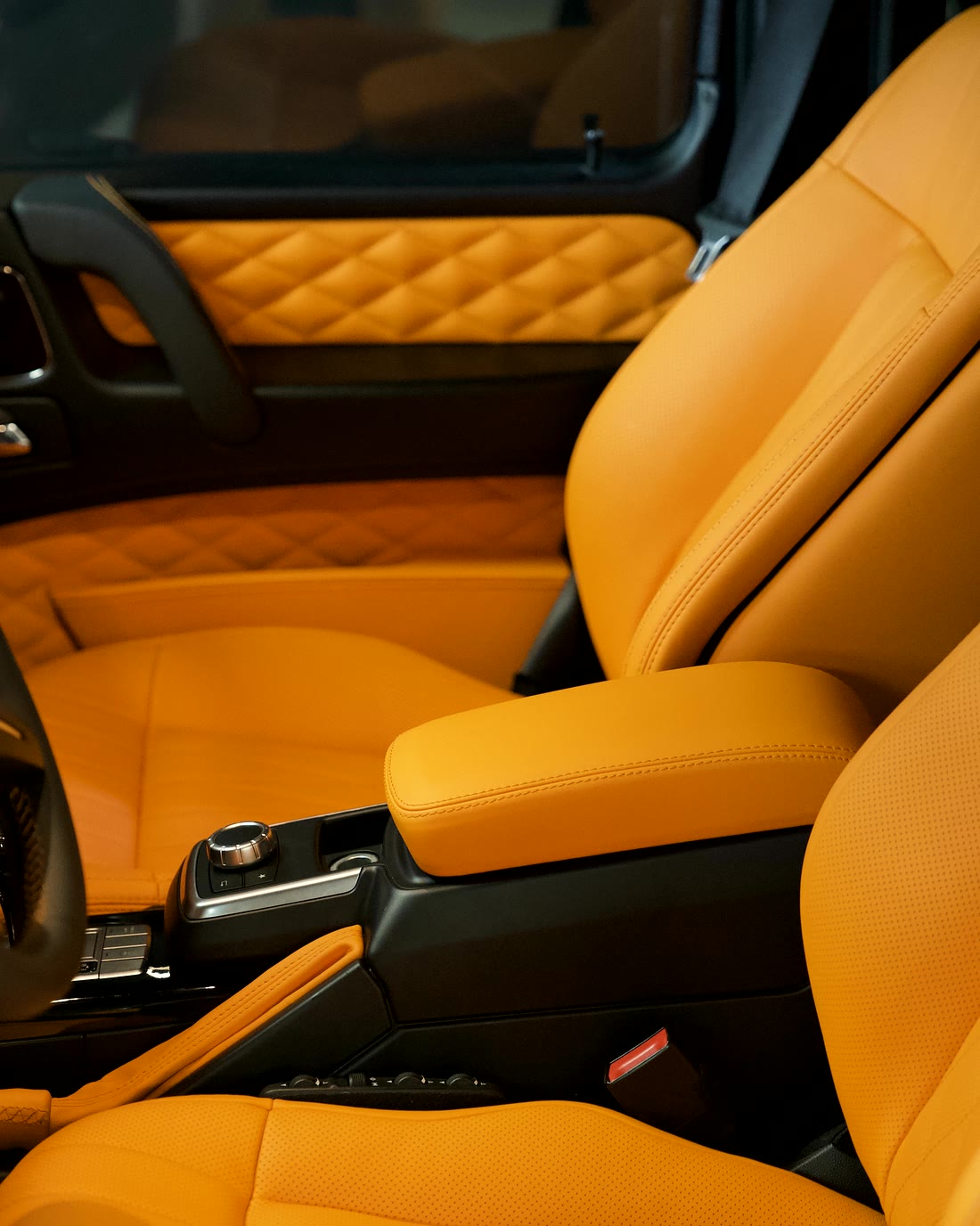 Diamond-quilted doors and a seat stitched to match.