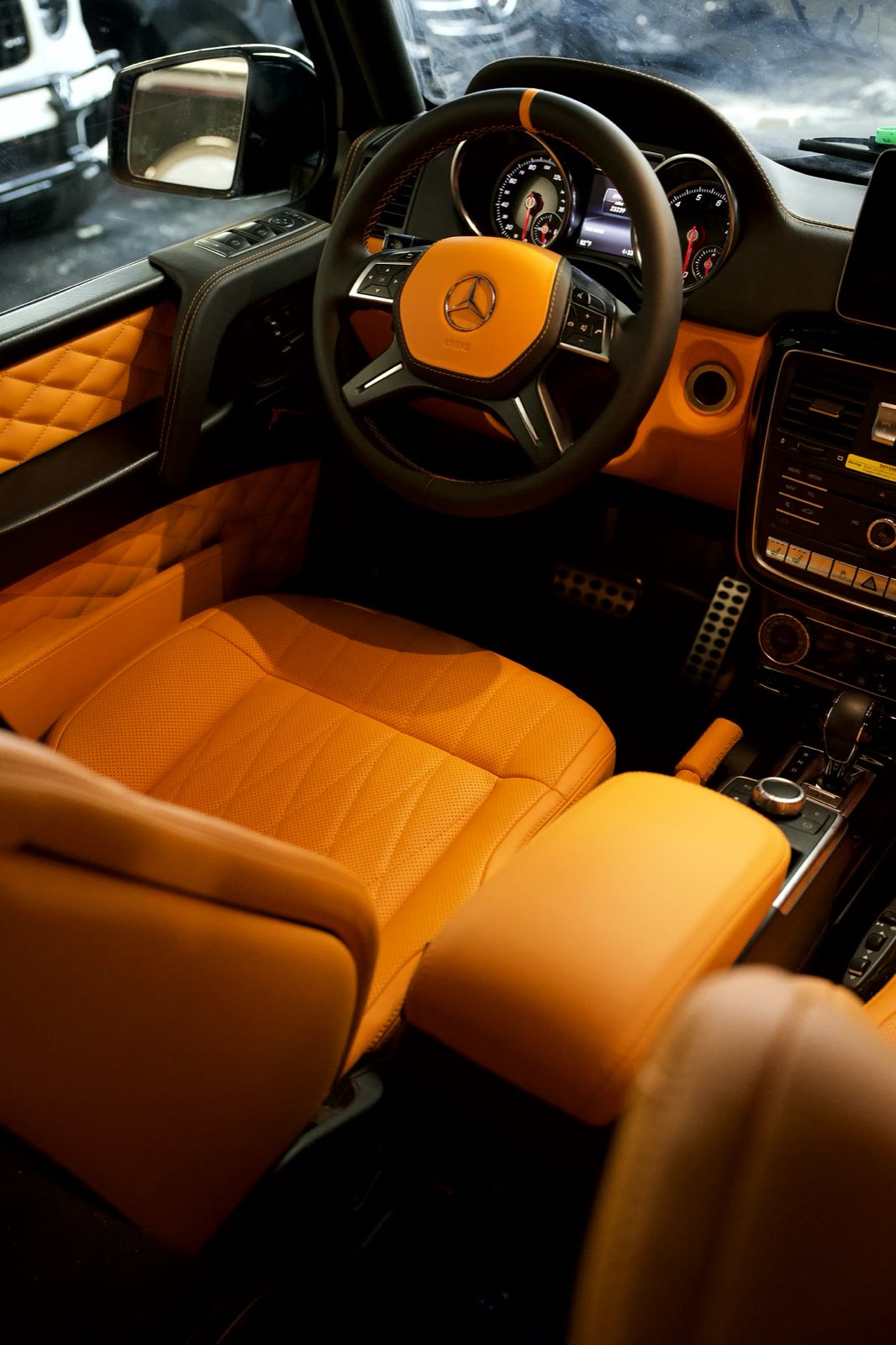 A G-Wagon cabin in orange leather with diamond-quilted door panels
