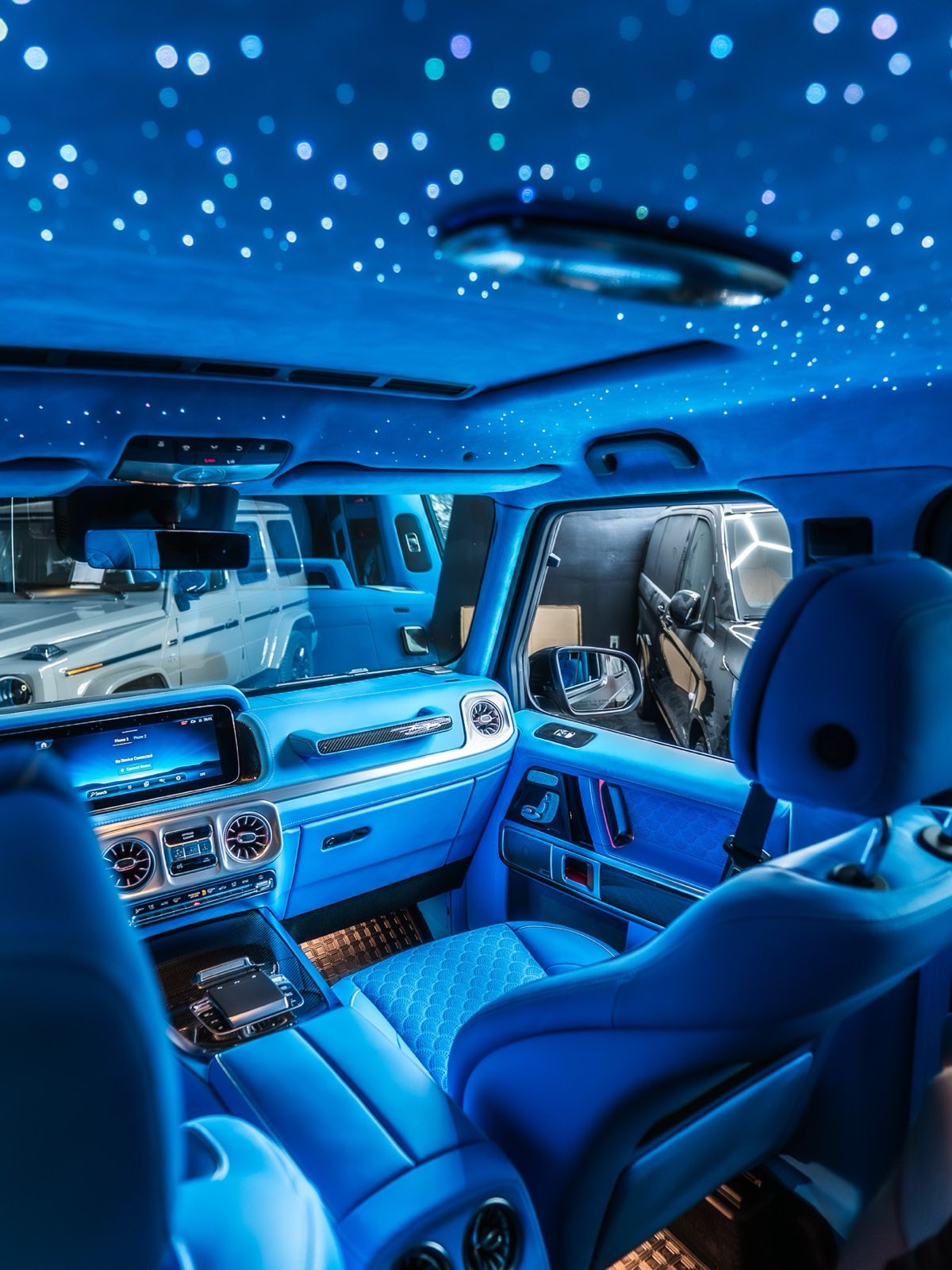 A G-Wagon cabin in sky blue leather under a starlight headliner