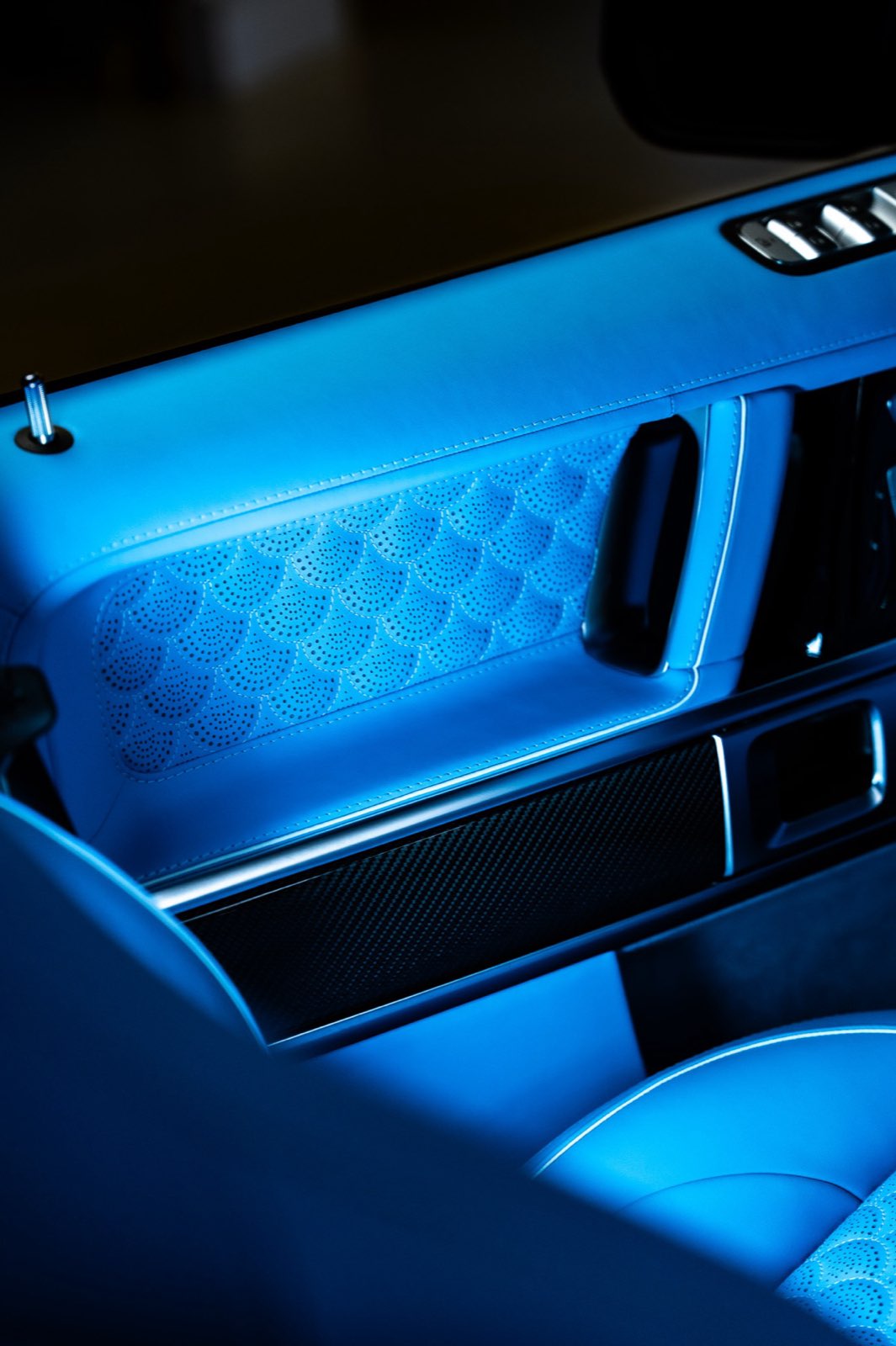 A G-Wagon door panel with a quilted sky blue insert