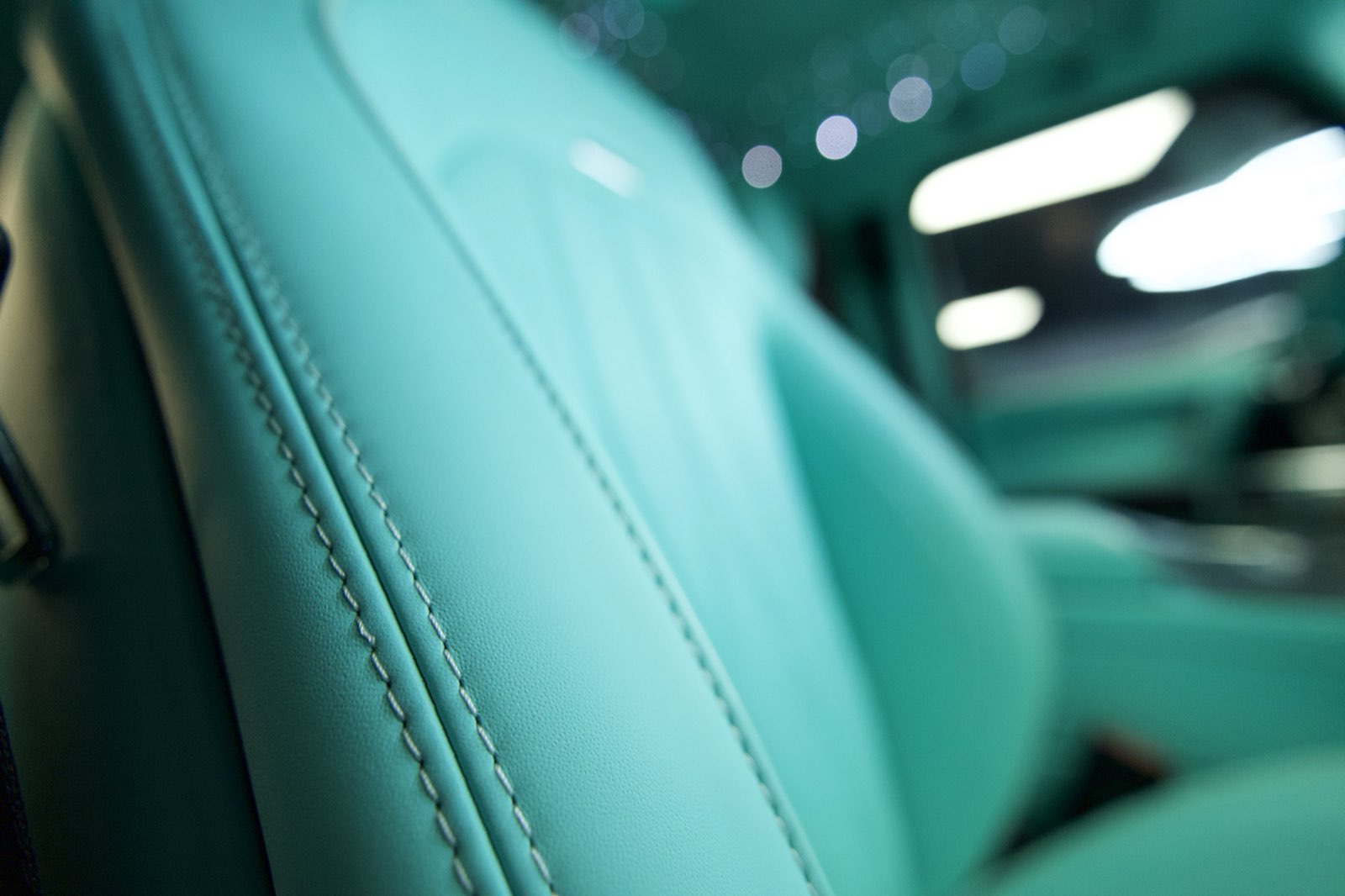 The side of a Tiffany blue seat
