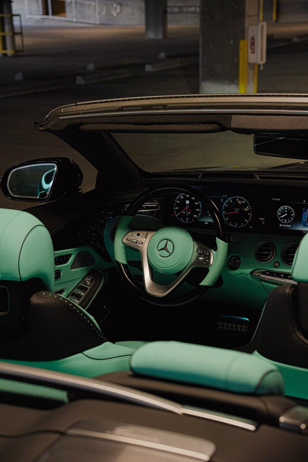 A Mercedes S-Class convertible cabin in mint green and black seen from above