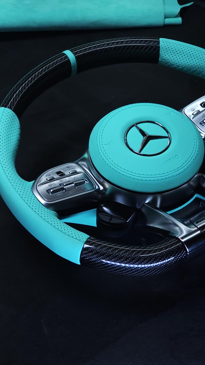 A Tiffany blue and carbon steering wheel on the bench