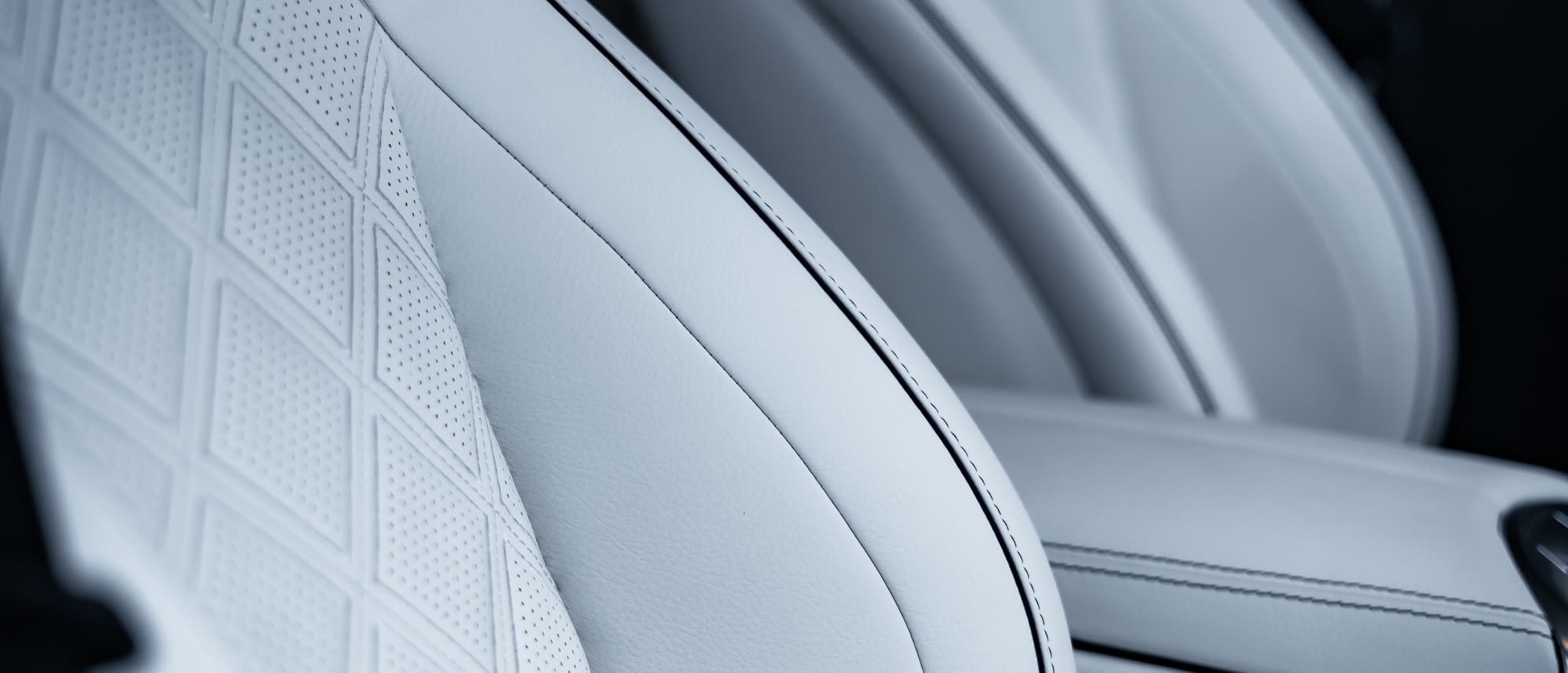 Front car seats re-trimmed in white quilted leather